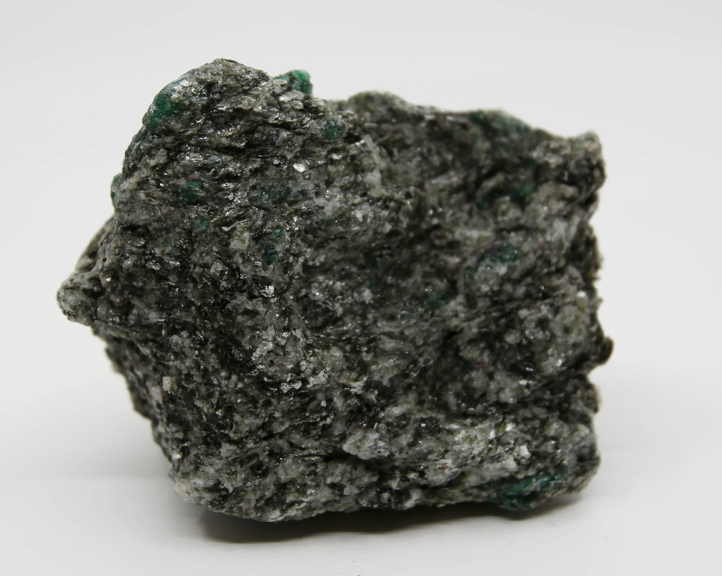 Natural emerald in a matrix of quartz and mica.